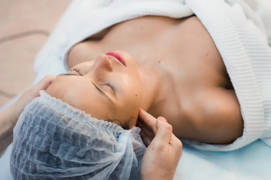 young woman enjoying facial at spa salon 2024 11 03 00 52 29 utc